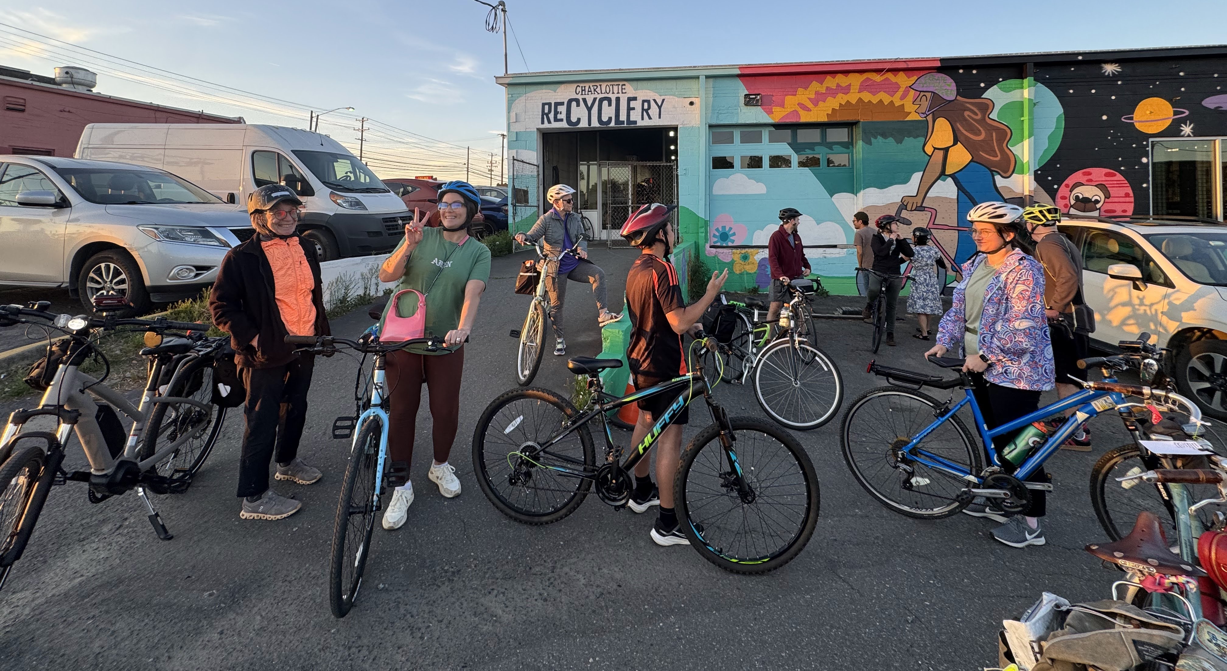 A group of people with bikes outside the Charlotte Recyclery.