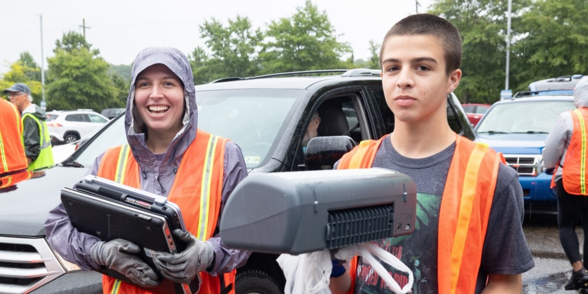 E-Cycling volunteers carrying electronics.